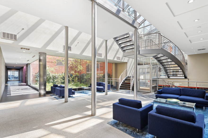 555 West 23rd Street, Unit S11C Manhattan, NY 10011 - Photo 8 of 12 a living room with furniture and a large window