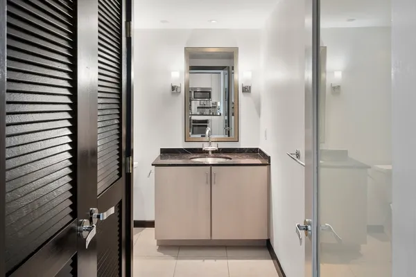 a bathroom with a sink and mirror
