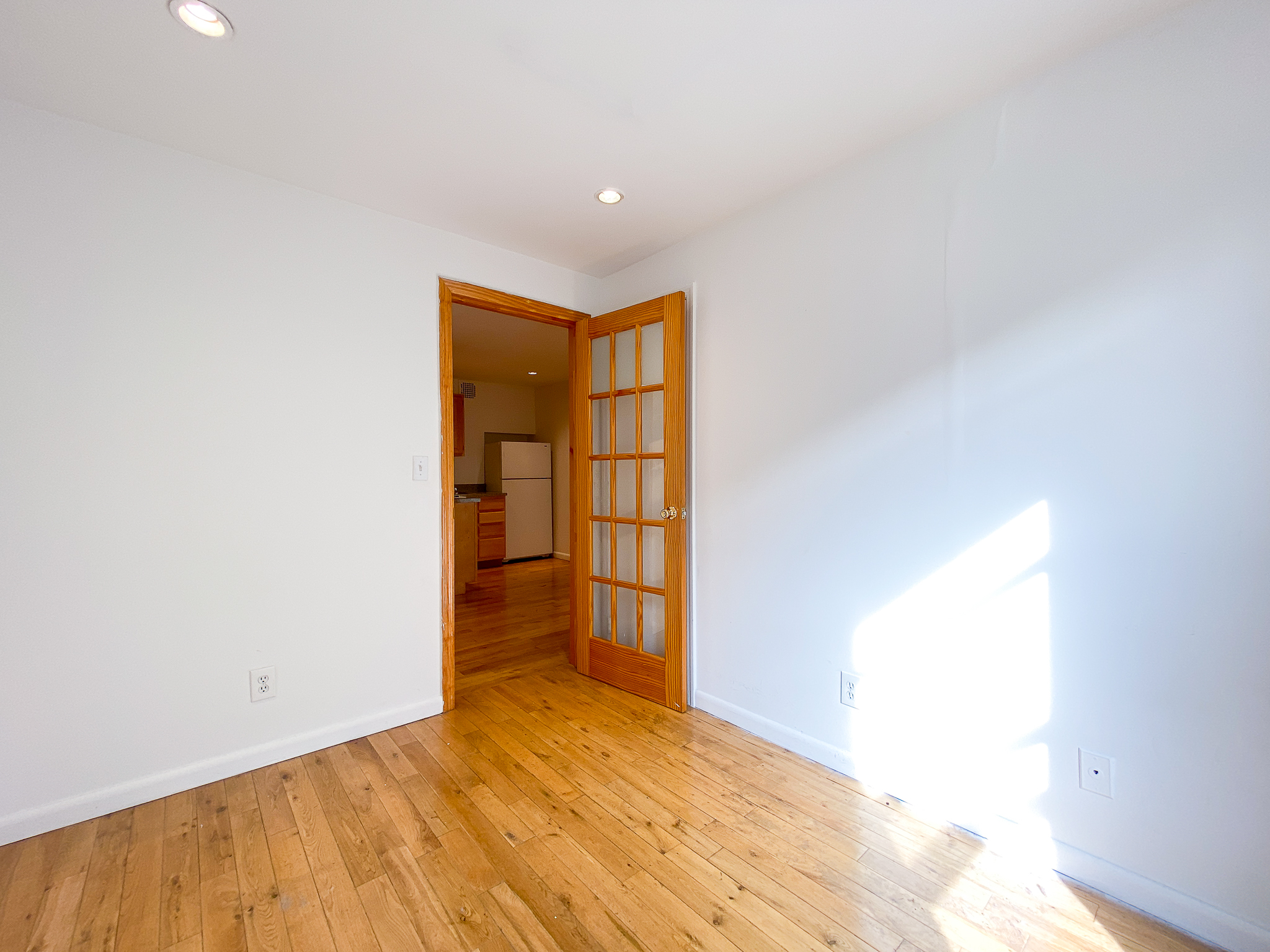 157 East 3rd Street, Unit 2B Manhattan, NY 10009 - Photo 10 of 18 a view of an empty room and window