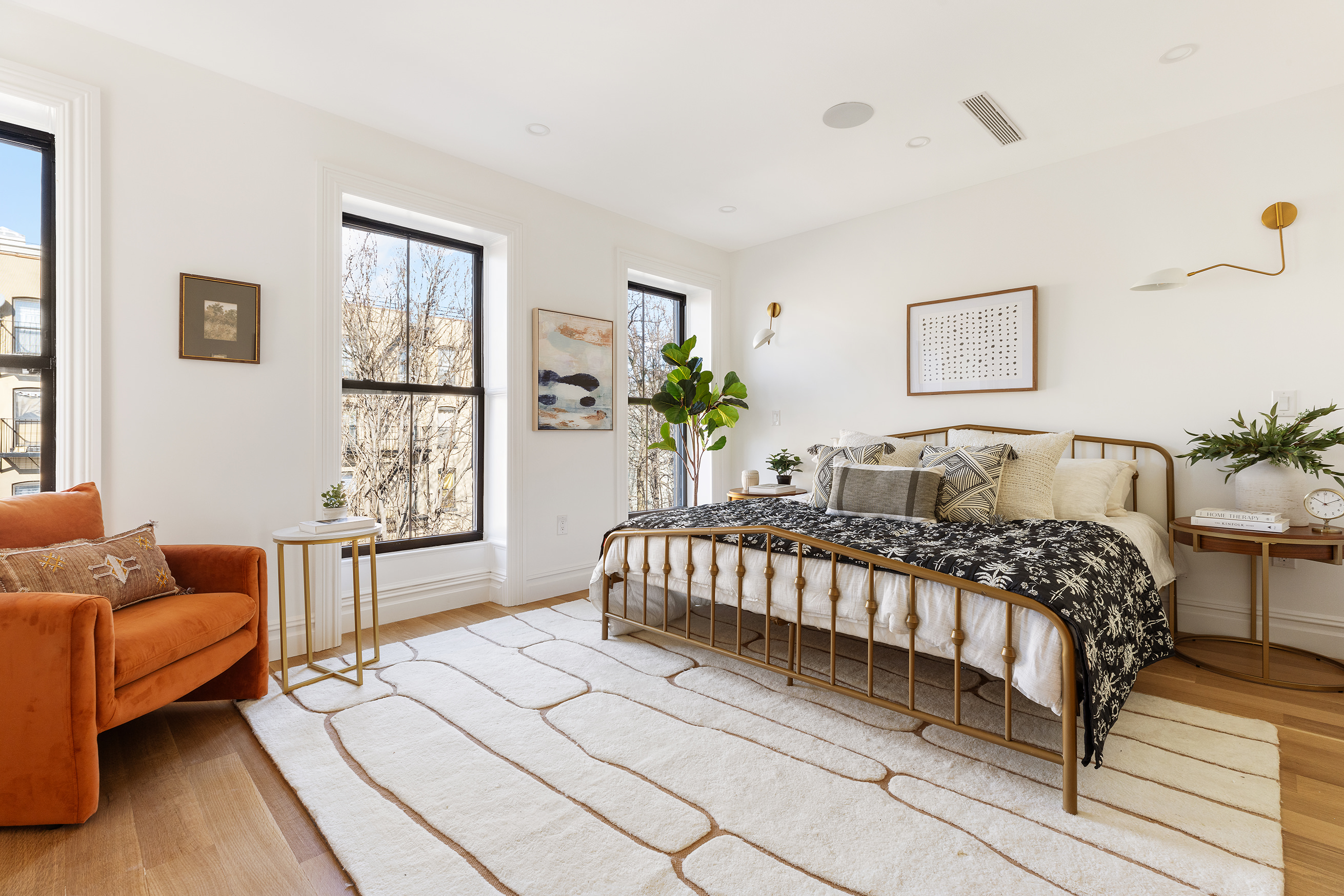 427 Quincy Street Brooklyn, NY 11221 - Photo 6 of 12 a bedroom with a bed and a couch