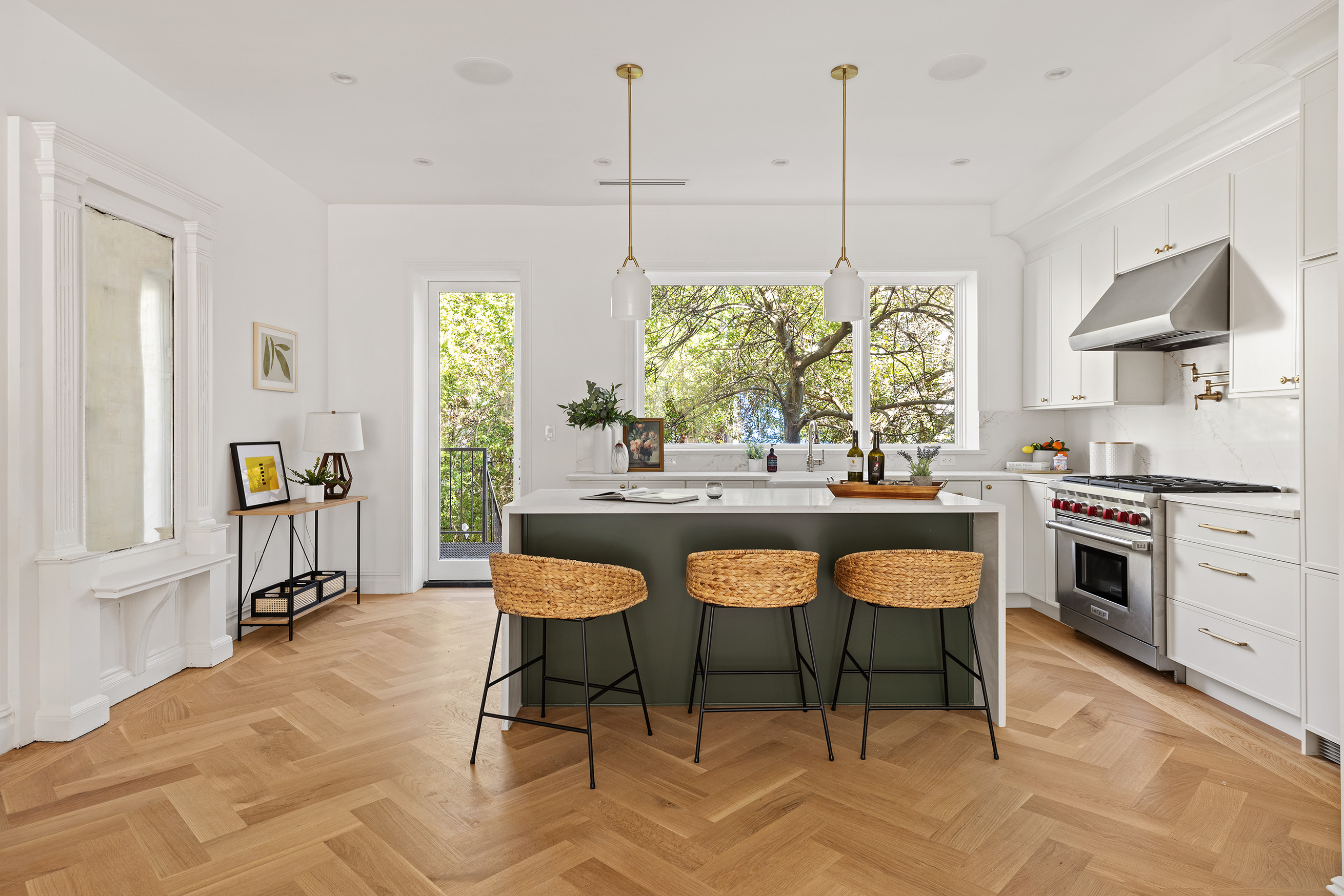 1433 Dean Street Brooklyn, NY 11213 - Photo 5 of 18 a kitchen with stainless steel appliances kitchen island a table and chairs in it