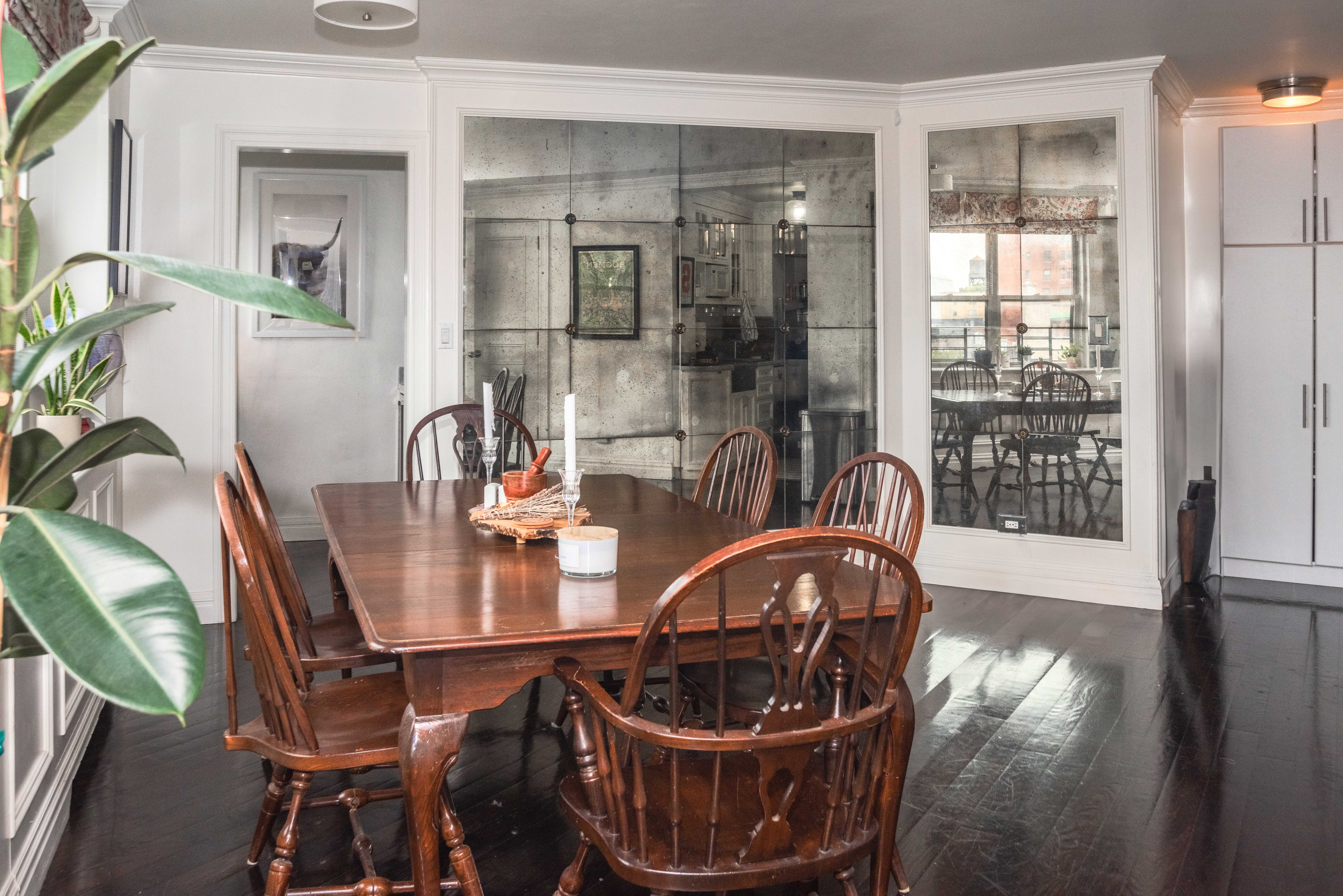 31 Jane Street, Unit 9AB Manhattan, NY 10014 - Photo 10 of 14 a dining room with furniture and wooden floor