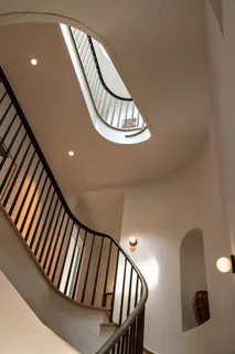 a view of staircase with wooden floor
