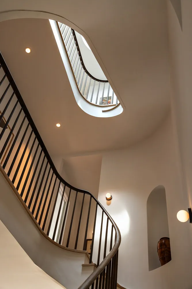 a view of staircase with wooden floor