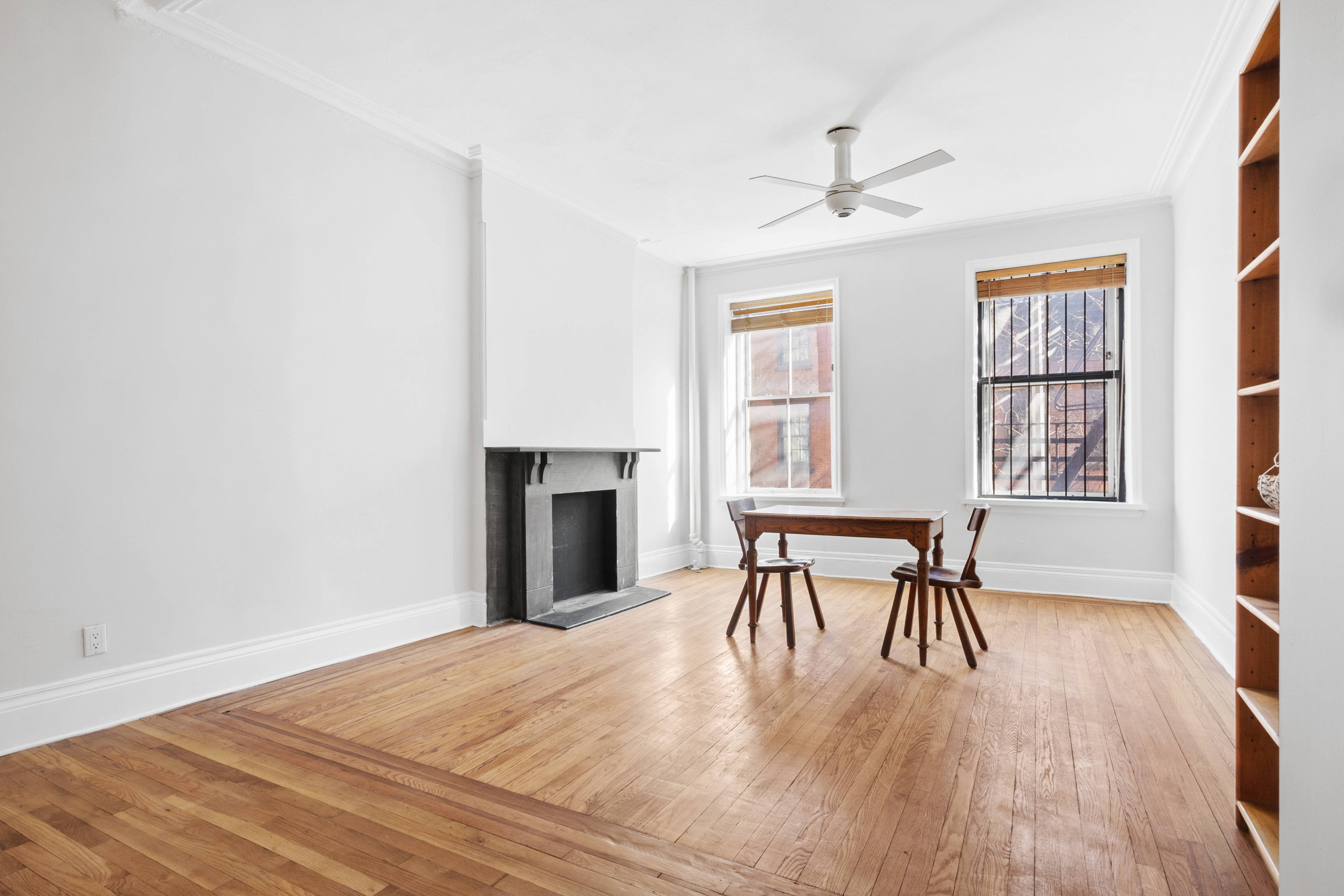 306 West 4th Street, Unit B1B2 Manhattan, NY 10014 - Photo 2 of 9 a dining room with a wooden table and chairs