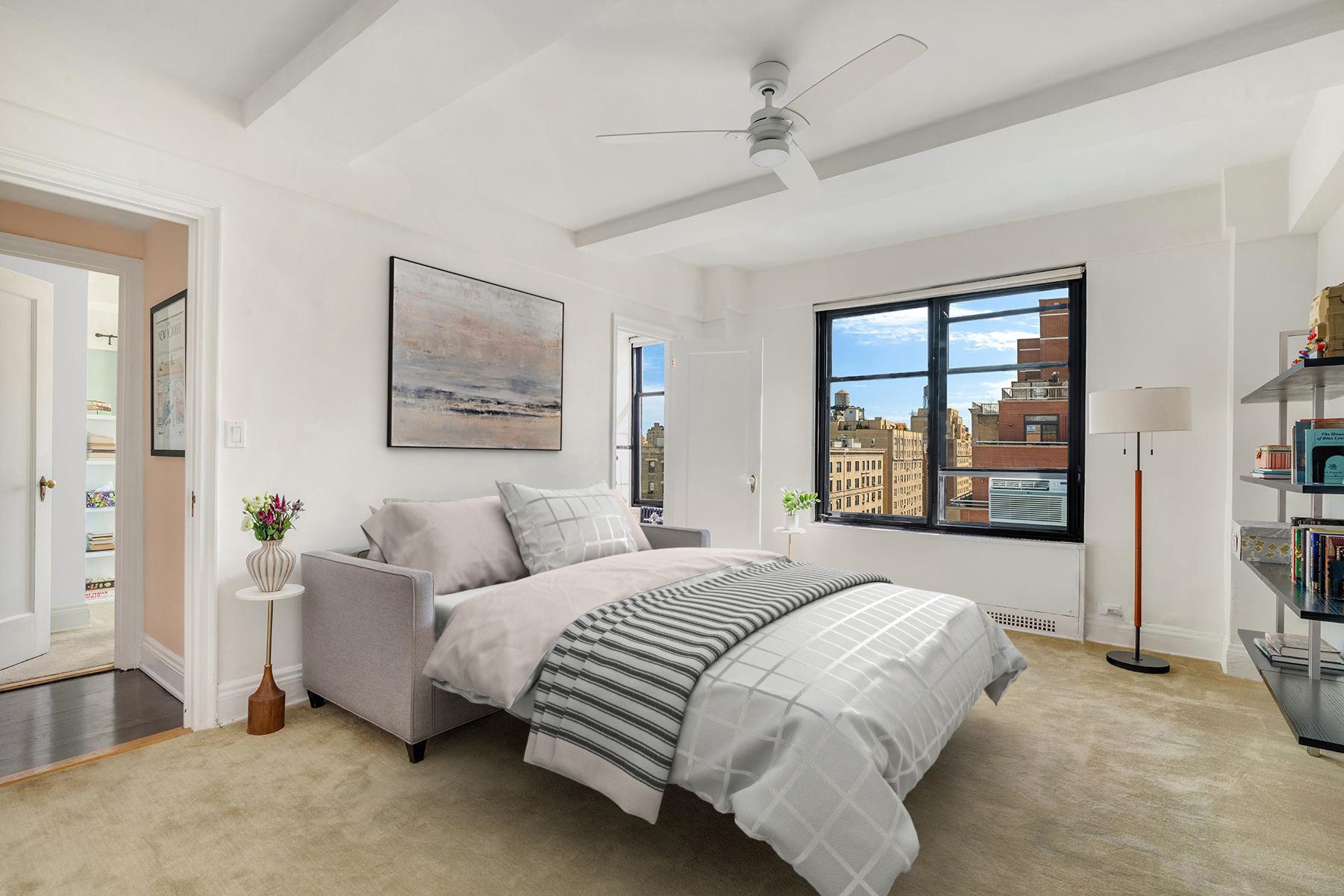 200 West 86th Street, Unit 17C Manhattan, NY 10024 - Photo 8 of 15 a bed room with a bed and a couch