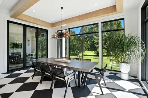 a view of an entryway with wooden floor