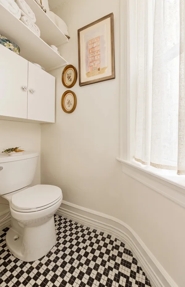 a bathroom with a toilet and a vanity