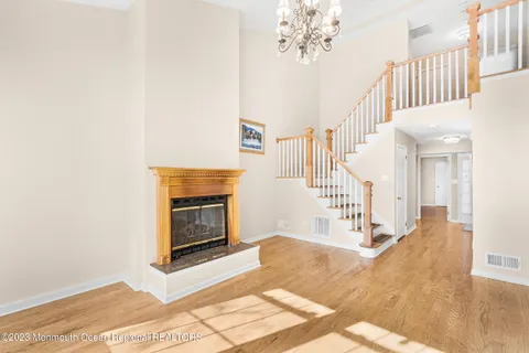 a view of an entryway with wooden floor