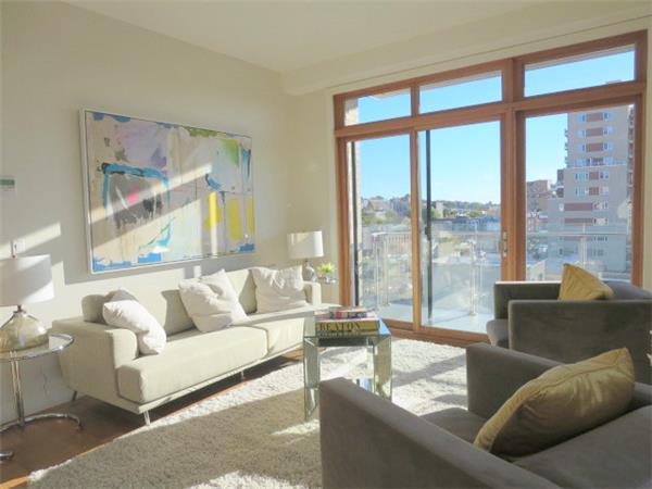 548 4th Avenue, Unit 8A Brooklyn, NY 11215 - Photo 2 of 21 a living room with furniture and a large window