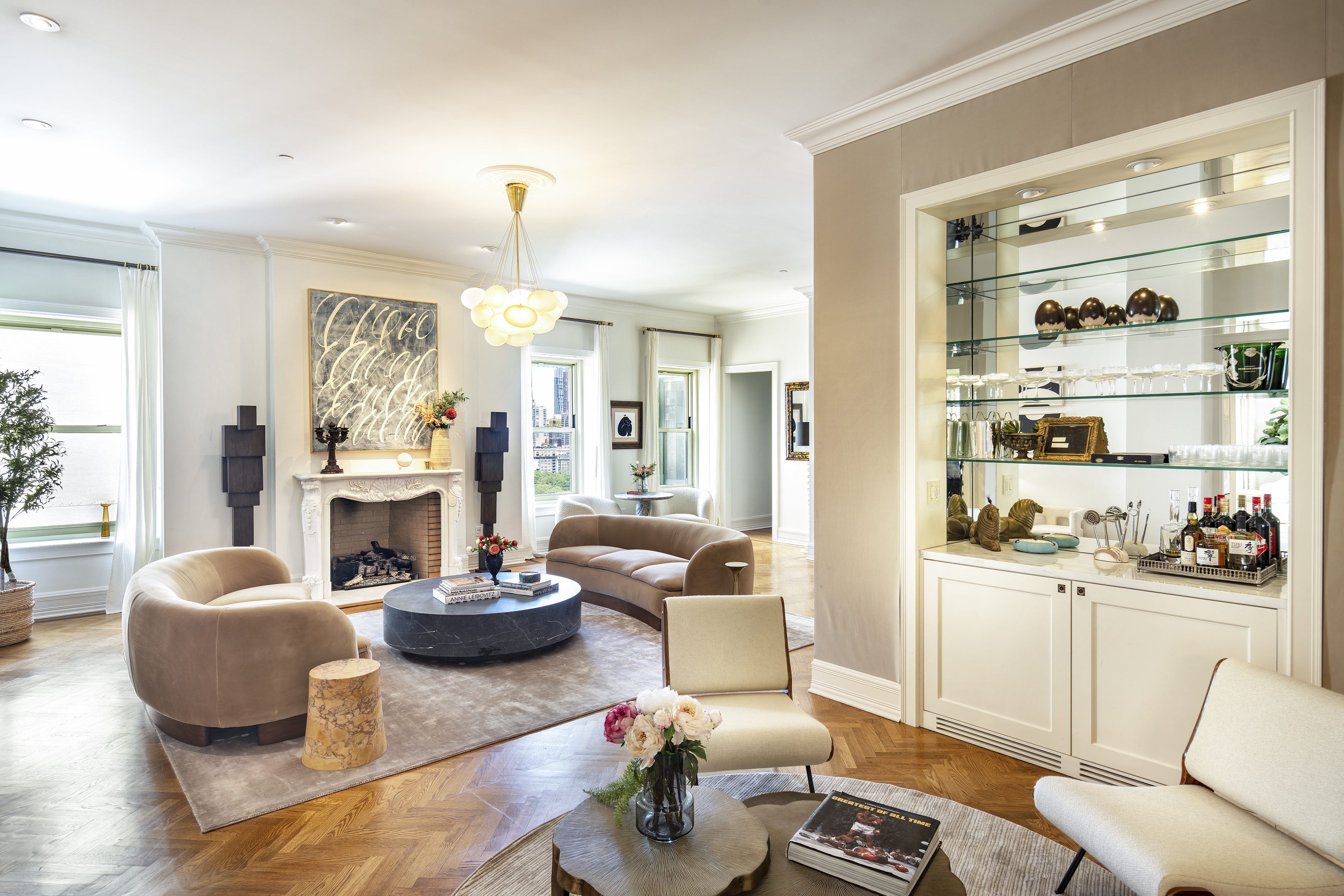 1 Central Park South, Unit 1801/1901 Manhattan, NY 10019 - Photo 8 of 21 a living room with furniture a fireplace and a large mirror