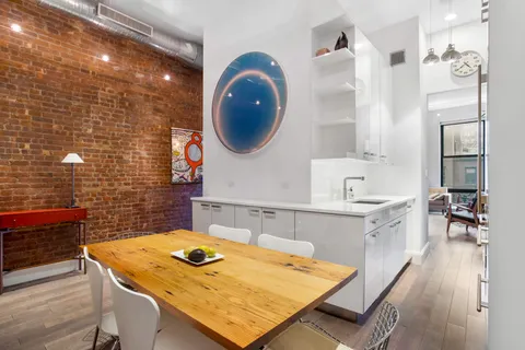 a bathroom with a sink a vanity and a mirror