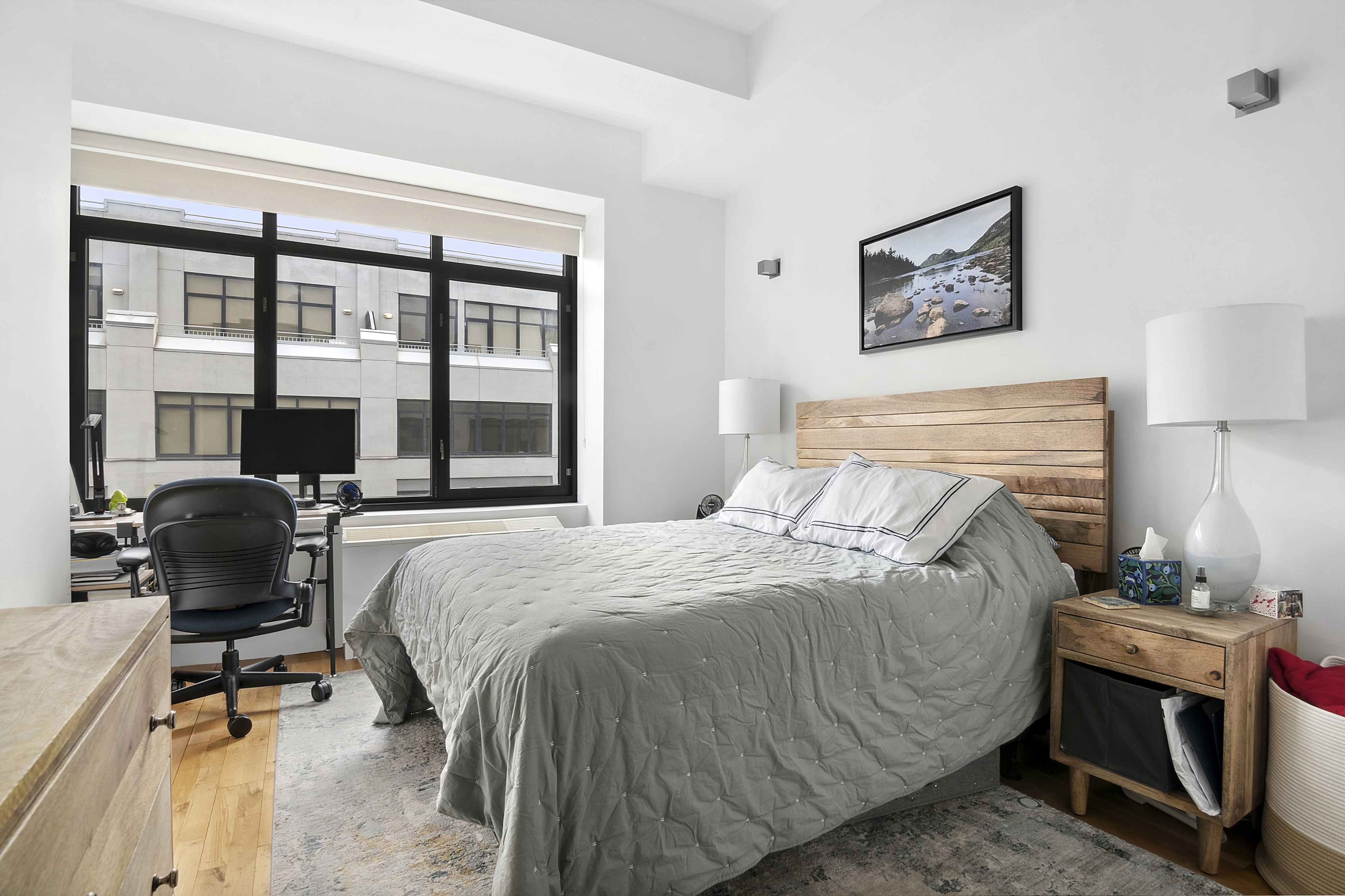 360 Furman Street, Unit 1138 Brooklyn, NY 11201 - Photo 4 of 34 a bedroom with a bed and a desk