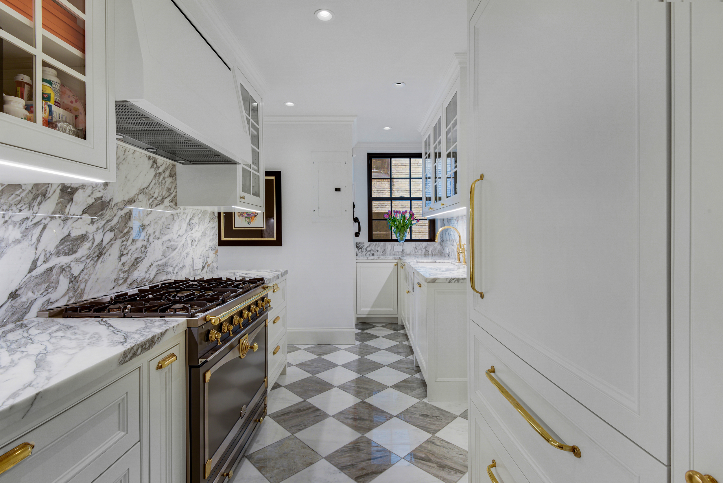 333 East 68th Street, Unit 6C Manhattan, NY 10065 - Photo 6 of 13 a kitchen with stainless steel appliances granite countertop a stove and a sink