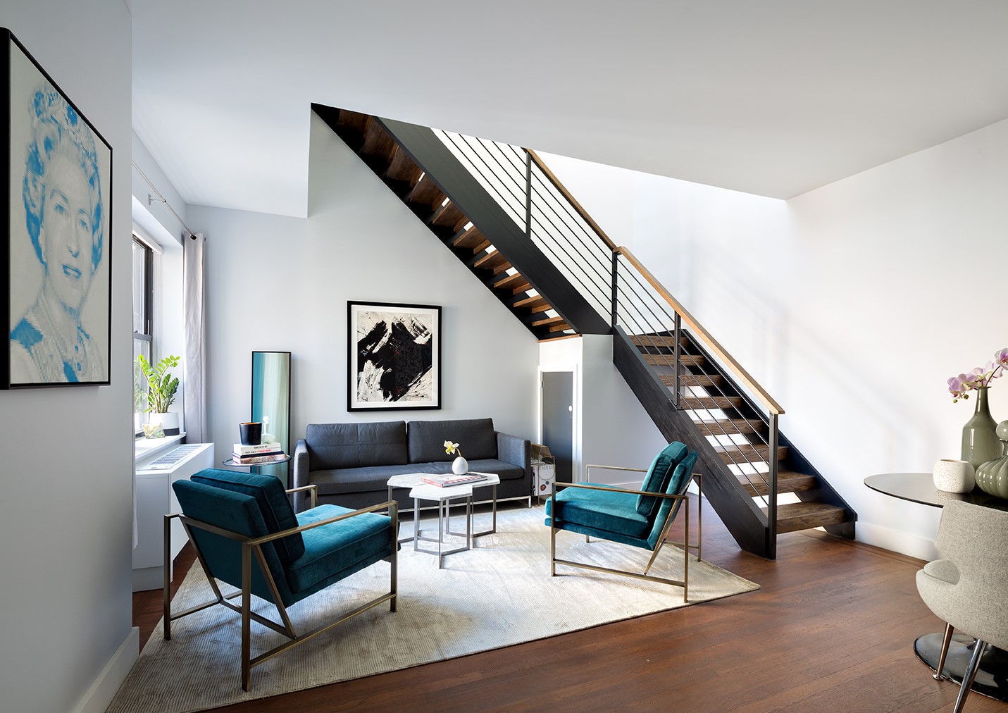245 West 25th Street, Unit PHD Manhattan, NY 10001 - Photo 2 of 16 a living room with furniture and wooden floor