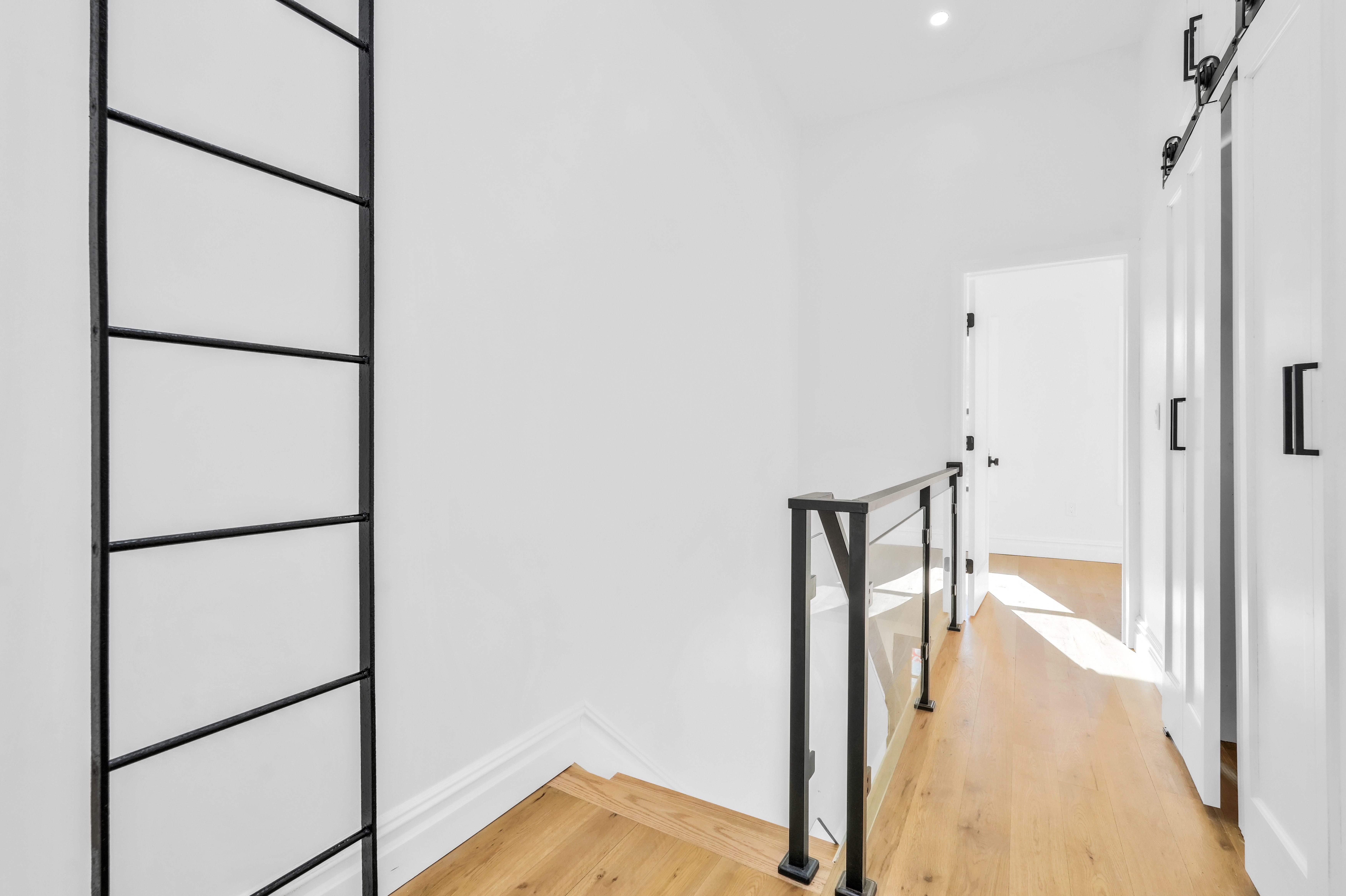 473 Monroe Street Brooklyn, NY 11221 - Photo 18 of 40 a view of hallway with wooden floor