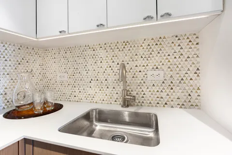 a bathroom with a bathtub and sink