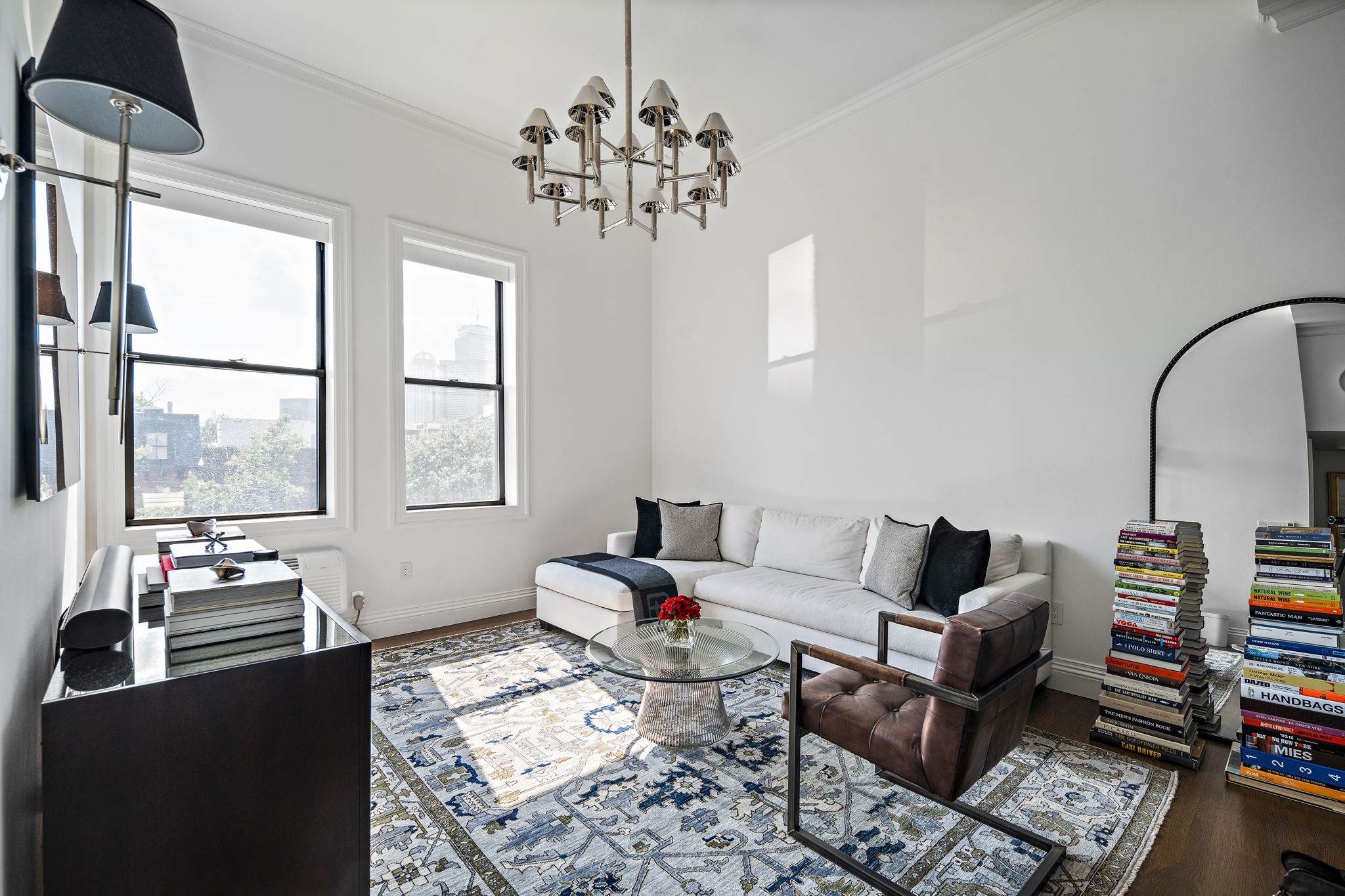 9 Appleton Street, Unit 302 Boston, MA 02116 - Photo 4 of 10 a living room with furniture a flat screen tv and a window