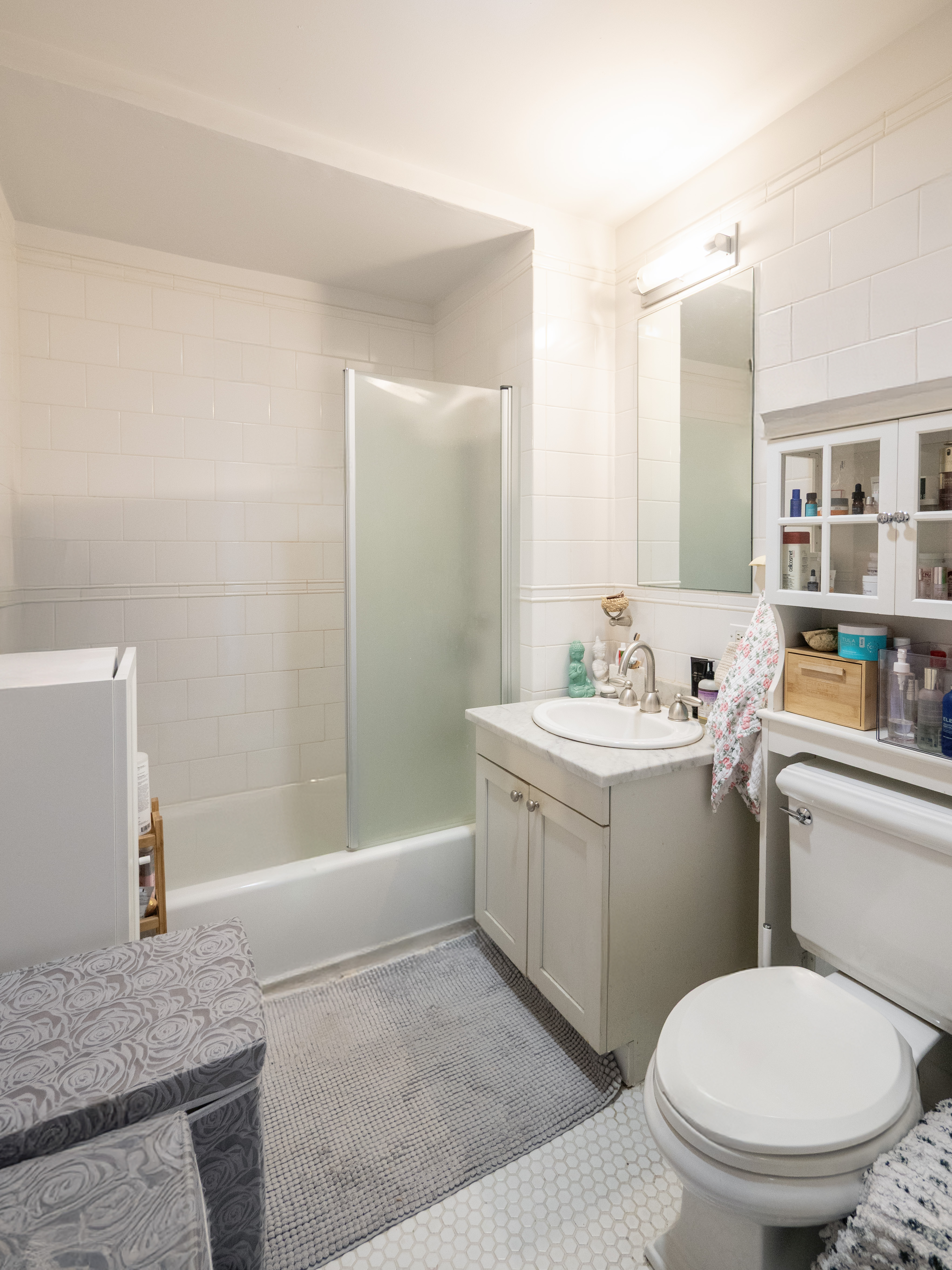 425 5th Avenue, Unit 31C Manhattan, NY 10016 - Photo 5 of 6 a bathroom with a sink toilet and shower