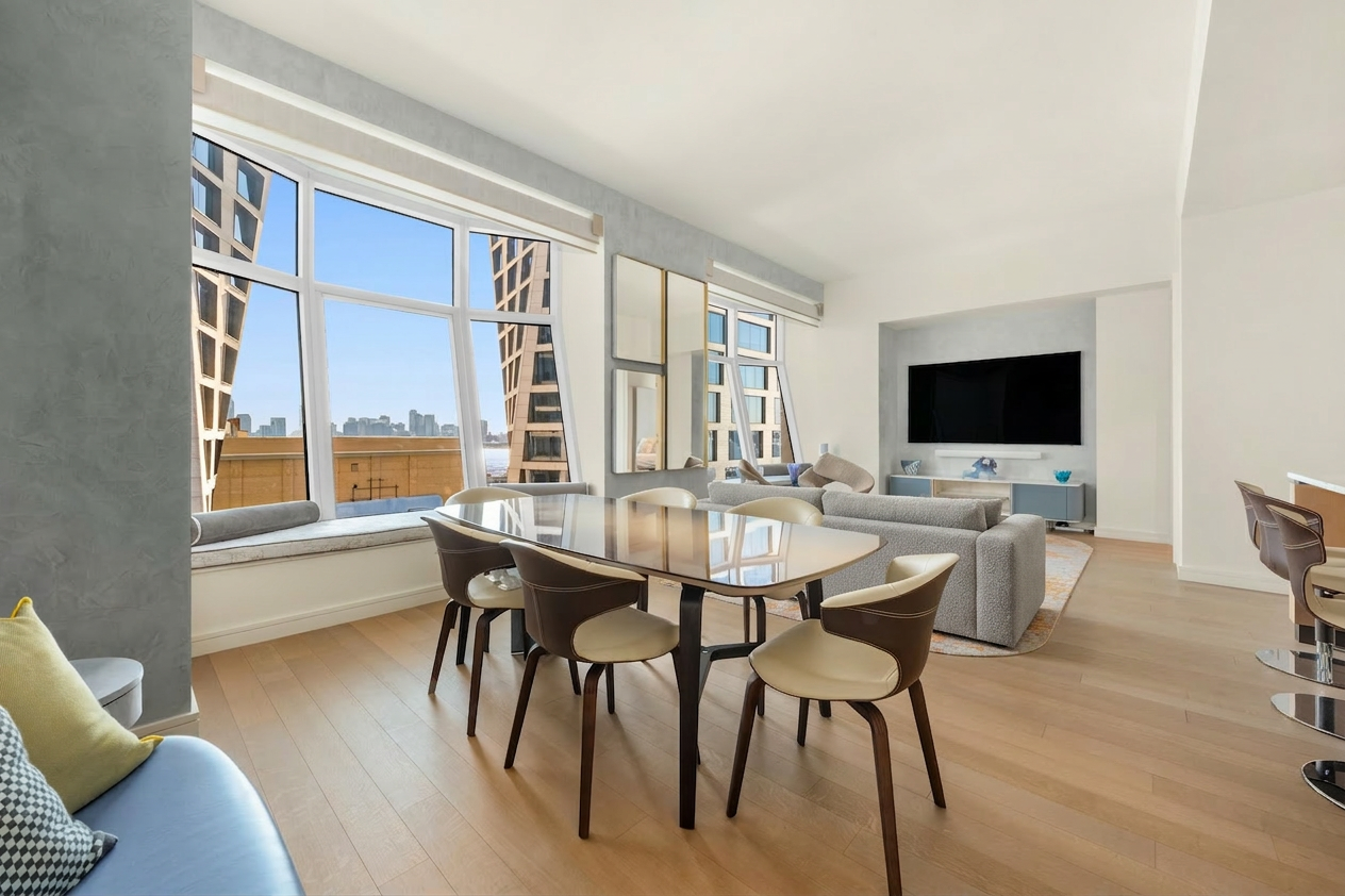 515 West 18th Street, Unit 1403 Manhattan, NY 10011 - Photo 1 of 21 a view of a dining room with furniture and wooden floor