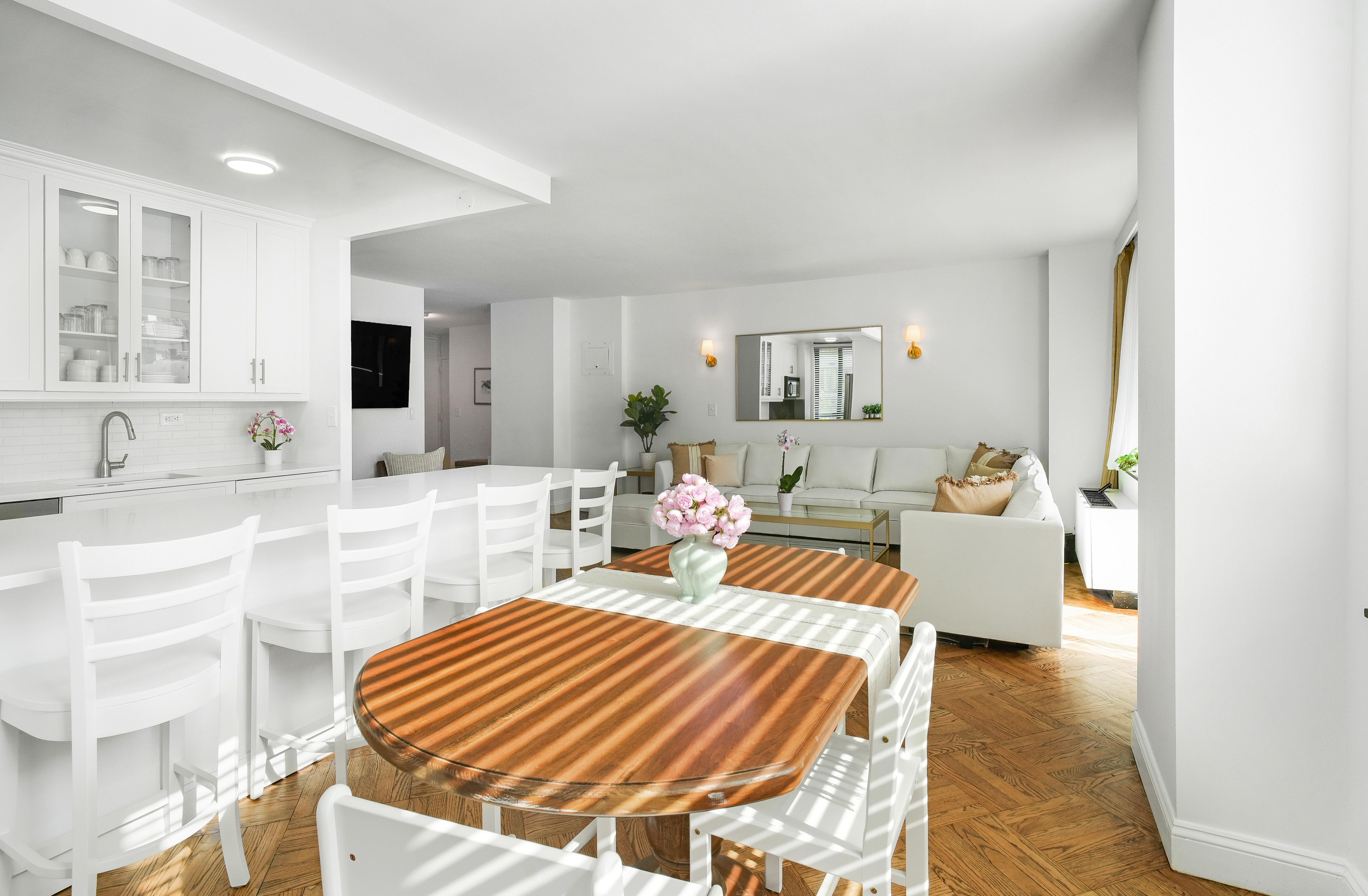 171 East 84th Street, Unit 4B Manhattan, NY 10028 - Photo 4 of 20 a living room with furniture and a table