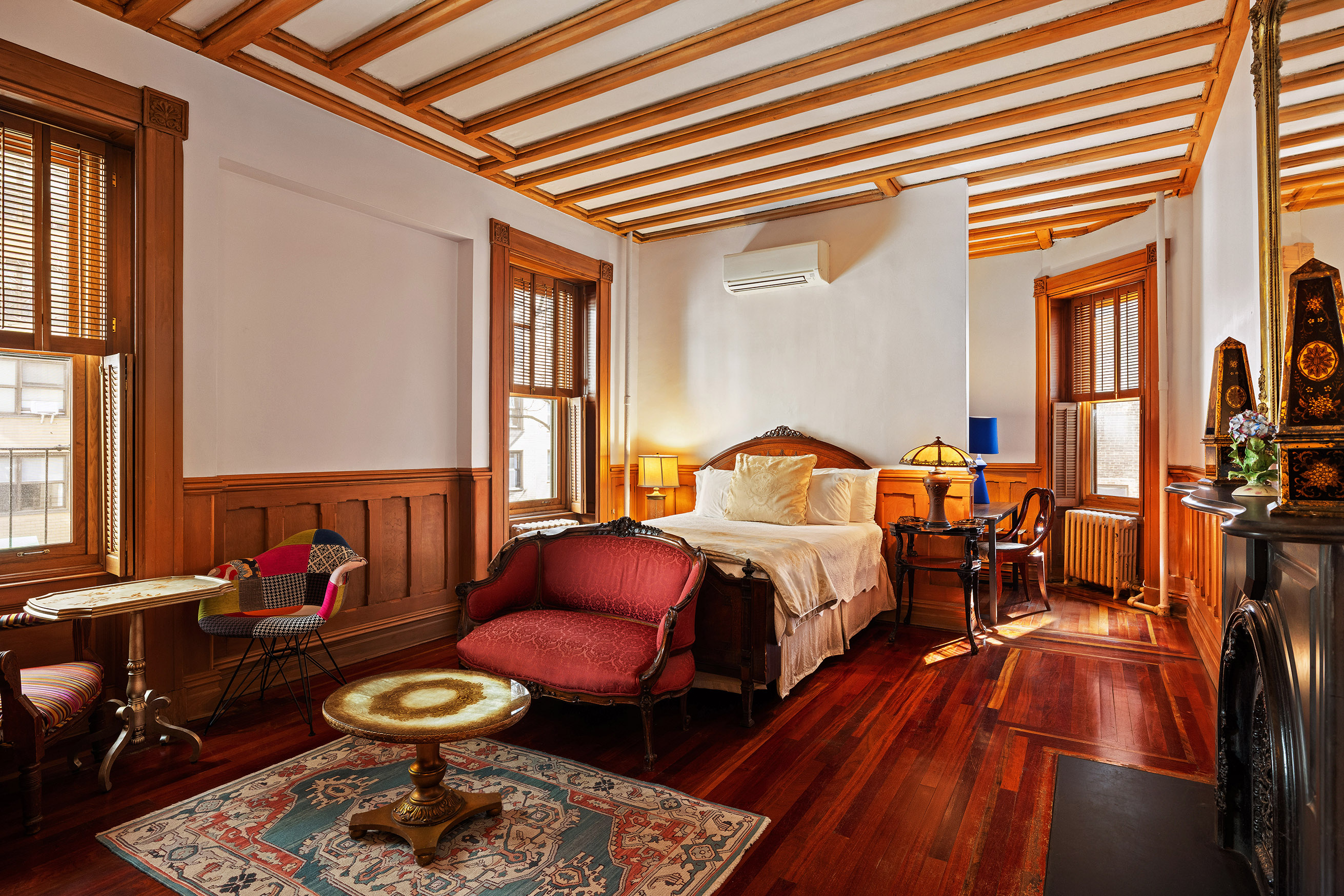a bedroom with furniture and a window