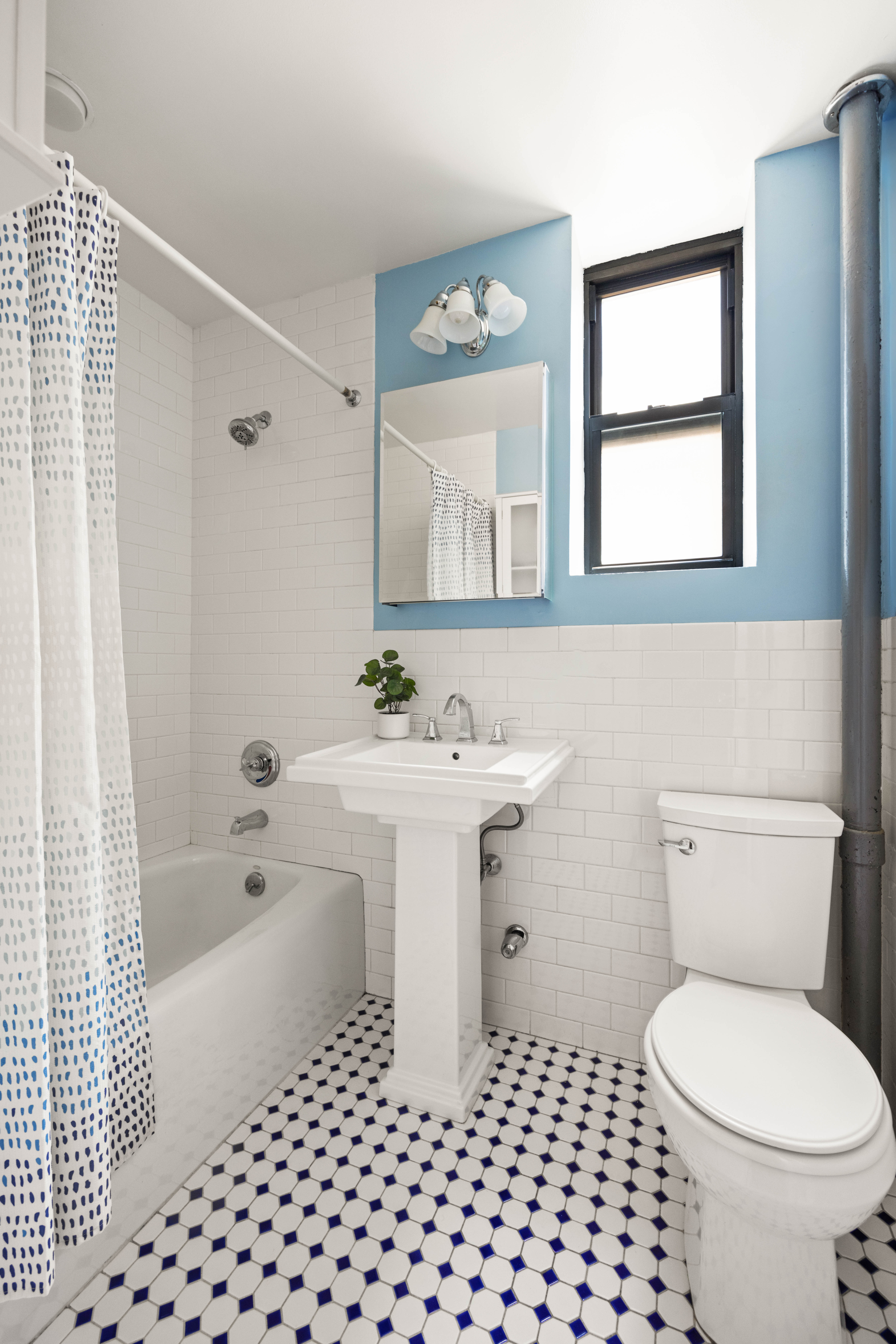 30 Ocean Parkway, Unit 5H Brooklyn, NY 11218 - Photo 11 of 17 a bathroom with a sink a toilet and shower