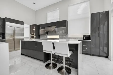 a view of kitchen with cabinets and outdoor seating