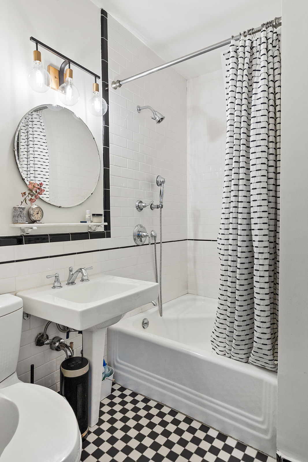 198 6th Avenue Manhattan, NY 10013 - Photo 7 of 45 a bathroom with a sink a toilet and shower