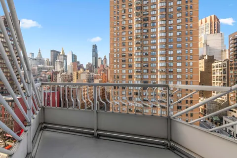 a view of a balcony with city view