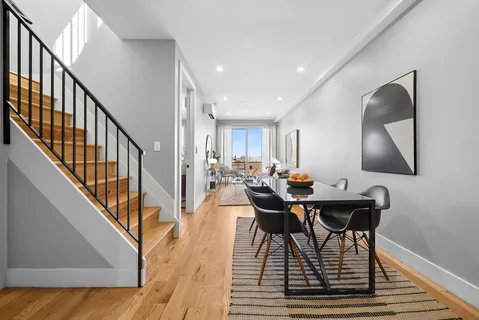 a view of a dining room with furniture