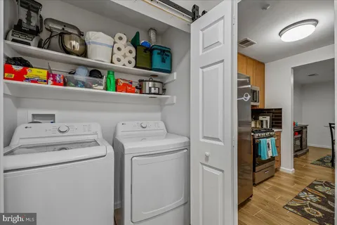 a view of storage and utility room with washer and dryer