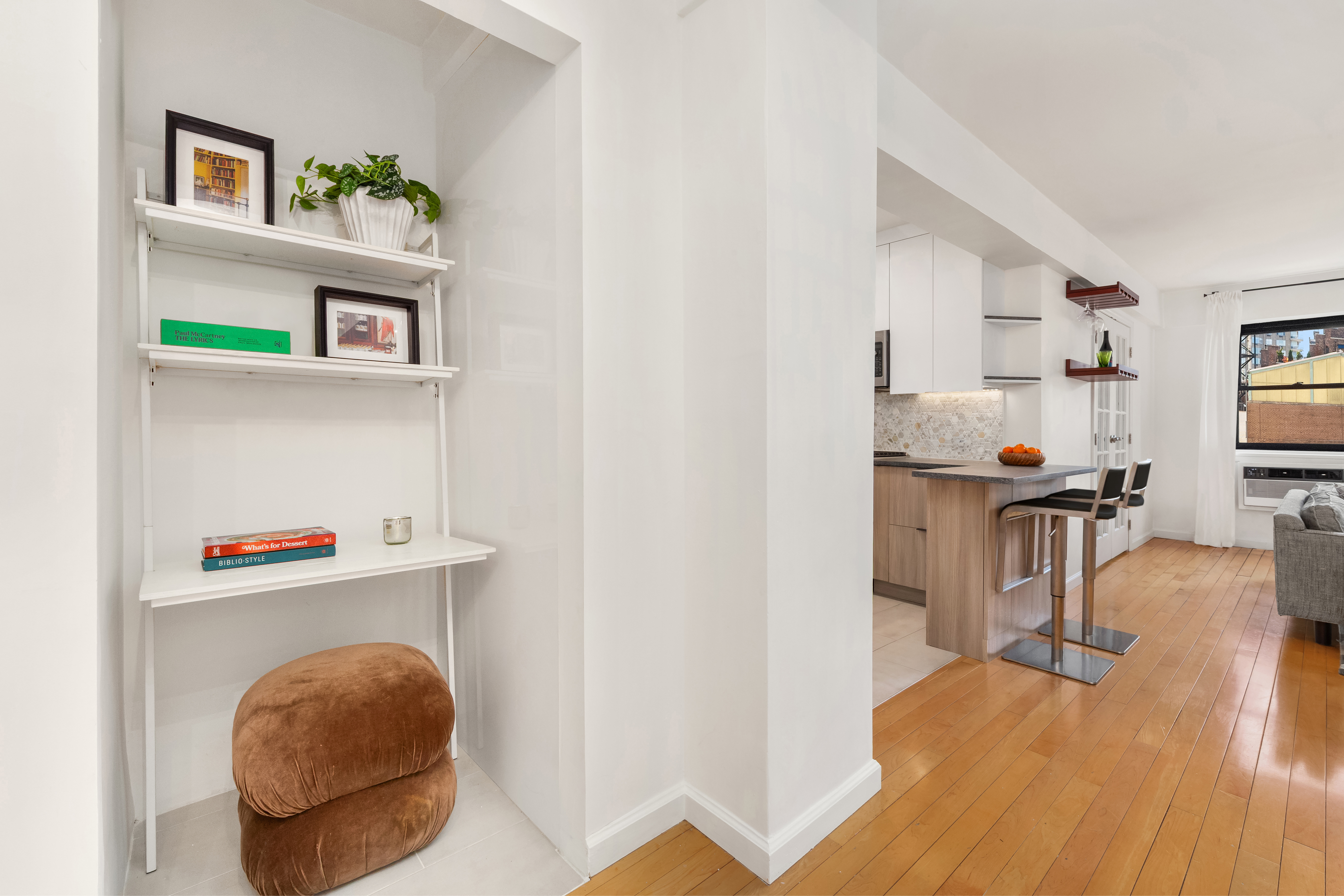 181 East 73rd Street, Unit 9C New York, NY 10021 - Photo 5 of 11 a living room with furniture and a flat screen tv