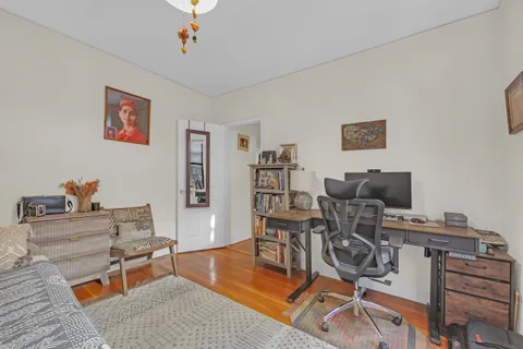 a work room with furniture and wooden floor