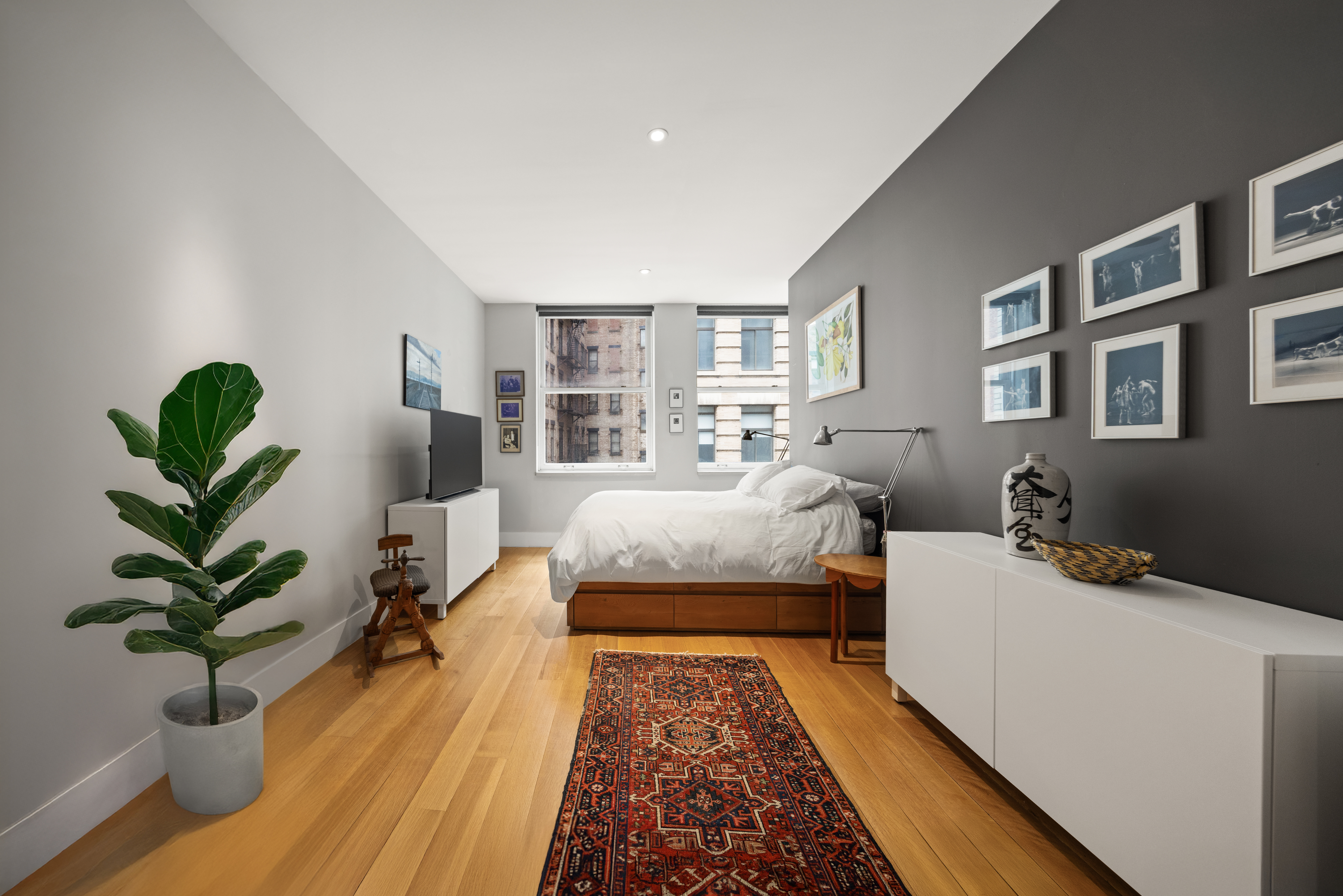 42 Ann Street, Unit 5 Manhattan, NY 10038 - Photo 10 of 16 a bed room with bed and a potted plant