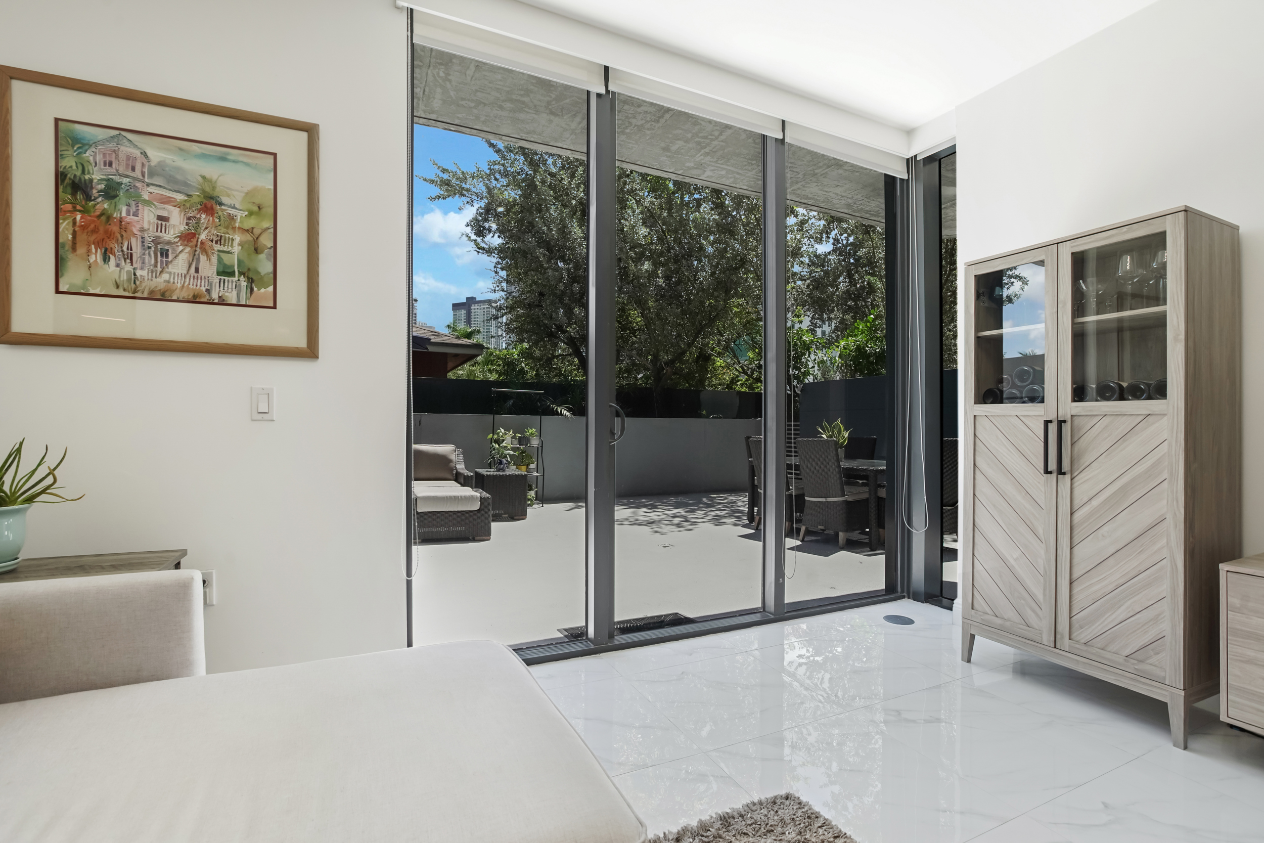 201 Southwest 17th Road, Unit 311 Miami, FL 33129 - Photo 5 of 21 a bedroom with furniture and large window