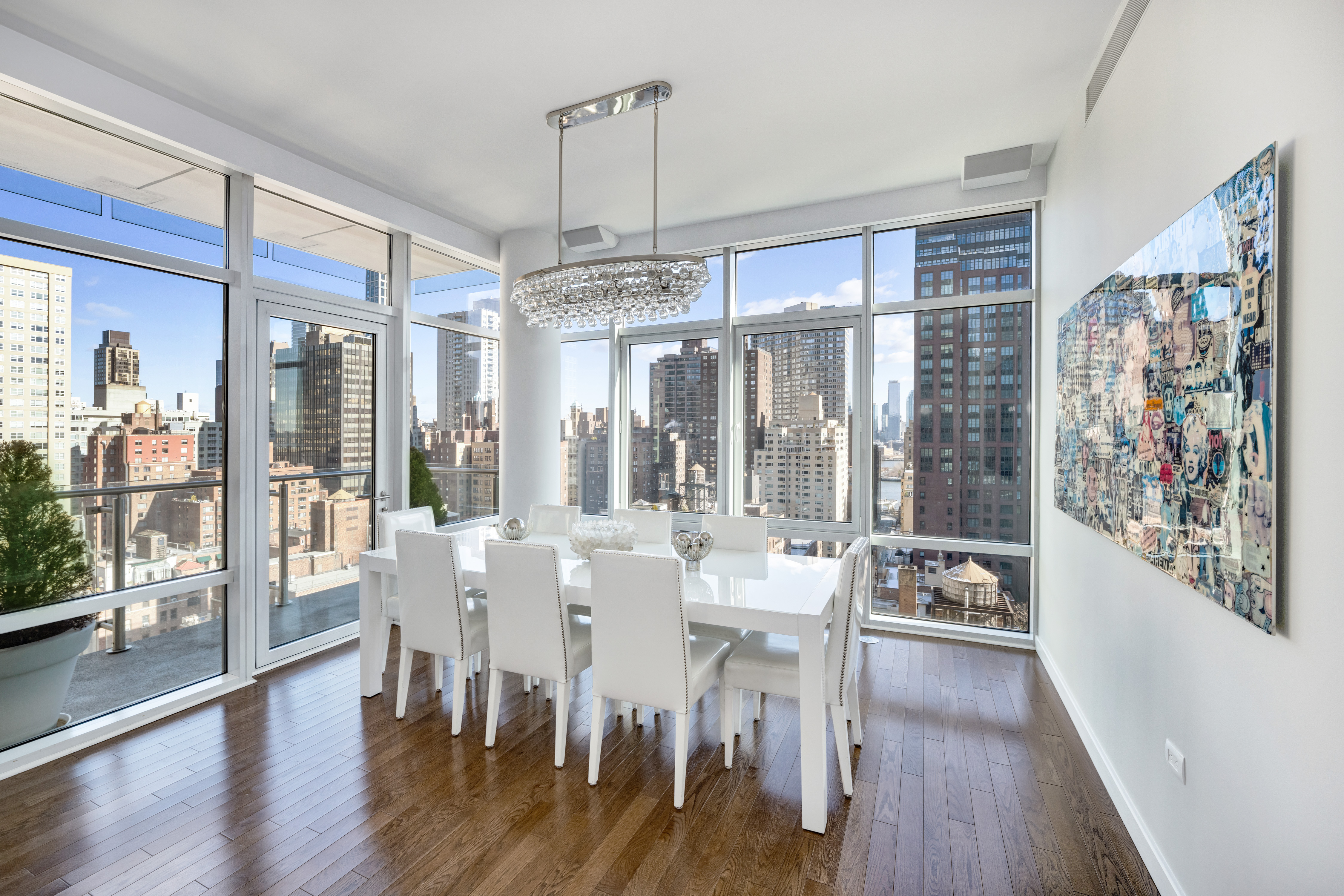 310 East 53rd Street, Unit 18A Manhattan, NY 10022 - Photo 6 of 19 a view of a dining room with furniture wooden floor and chandelier