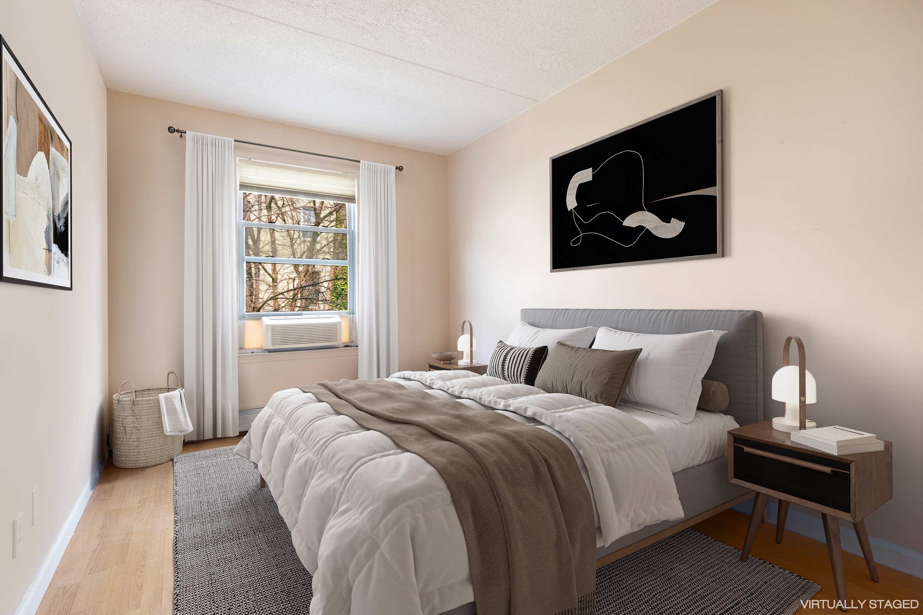 125 West 117th Street Manhattan, NY 10026 - Photo 12 of 23 a bedroom with a bed and a window