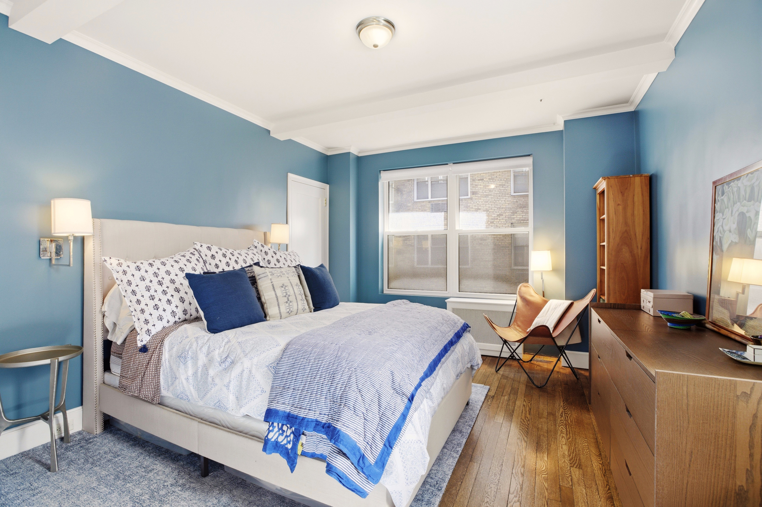 60 Gramercy Park North, Unit 8D Manhattan, NY 10010 - Photo 8 of 14 a bedroom with a bed and large windows