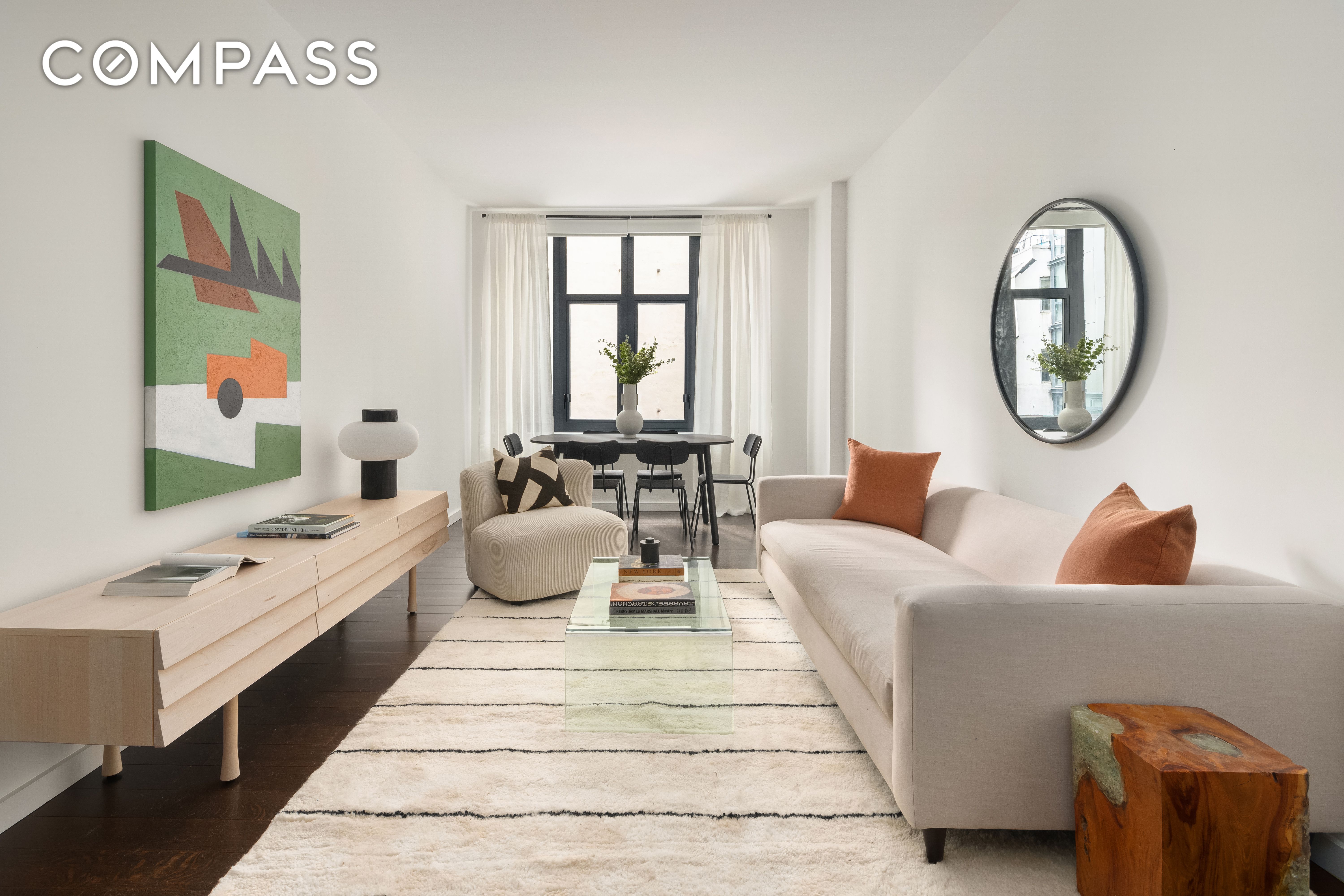 591 3rd Avenue, Unit 3C Manhattan, NY 10016 - Photo 7 of 9 a living room with furniture and a large window