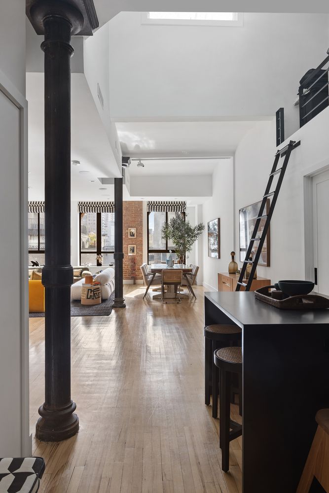 a view of a living room and workspace