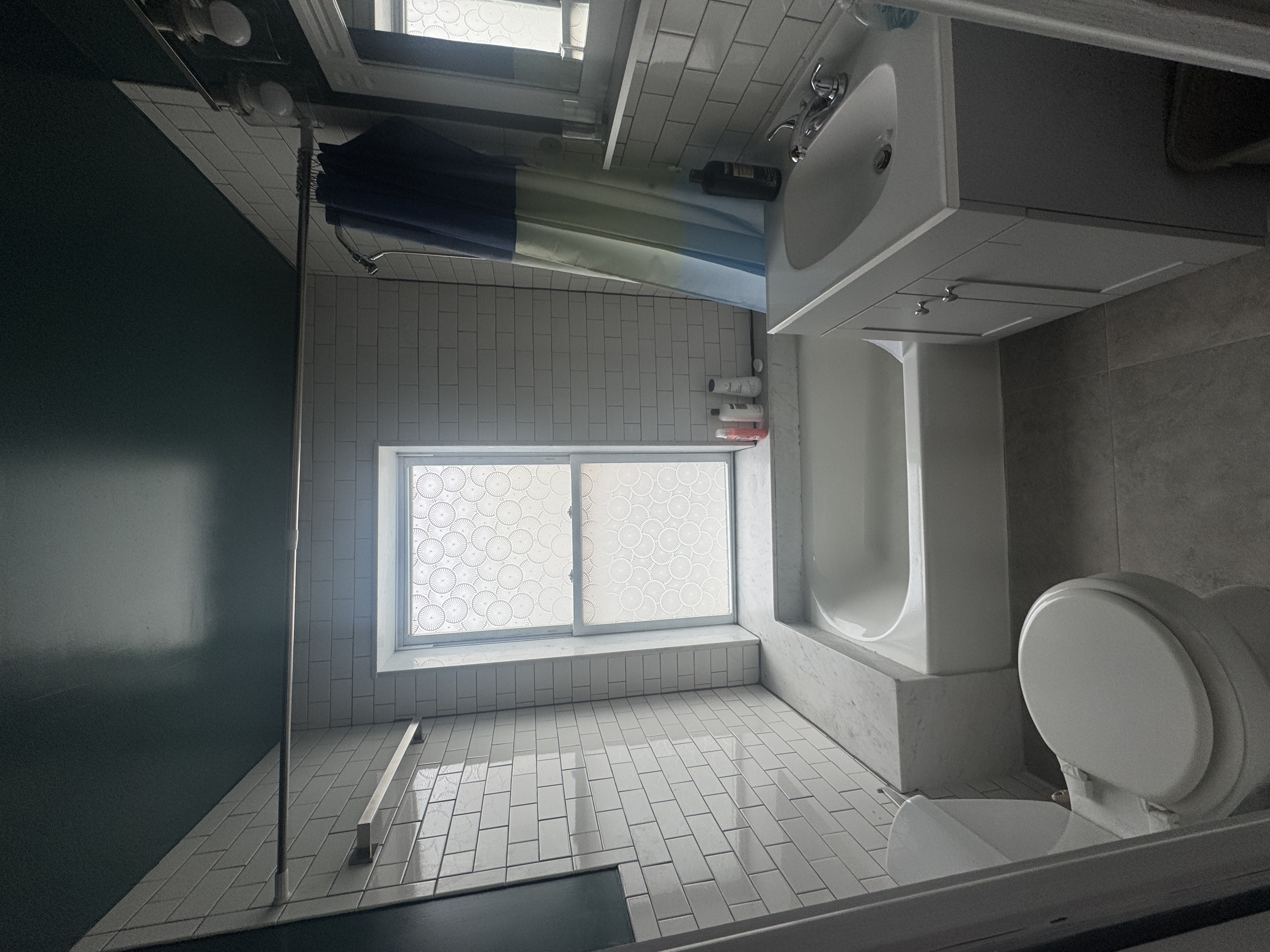 193 24th Street, Unit 2 Brooklyn, NY 11232 - Photo 5 of 7 a bathroom with a sink a toilet and bathtub