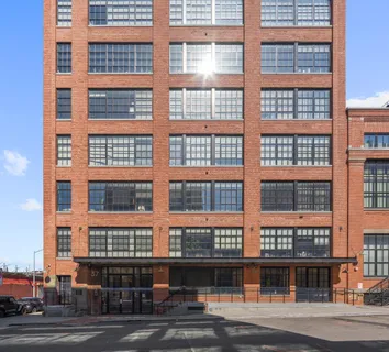 a front view of a building with a street