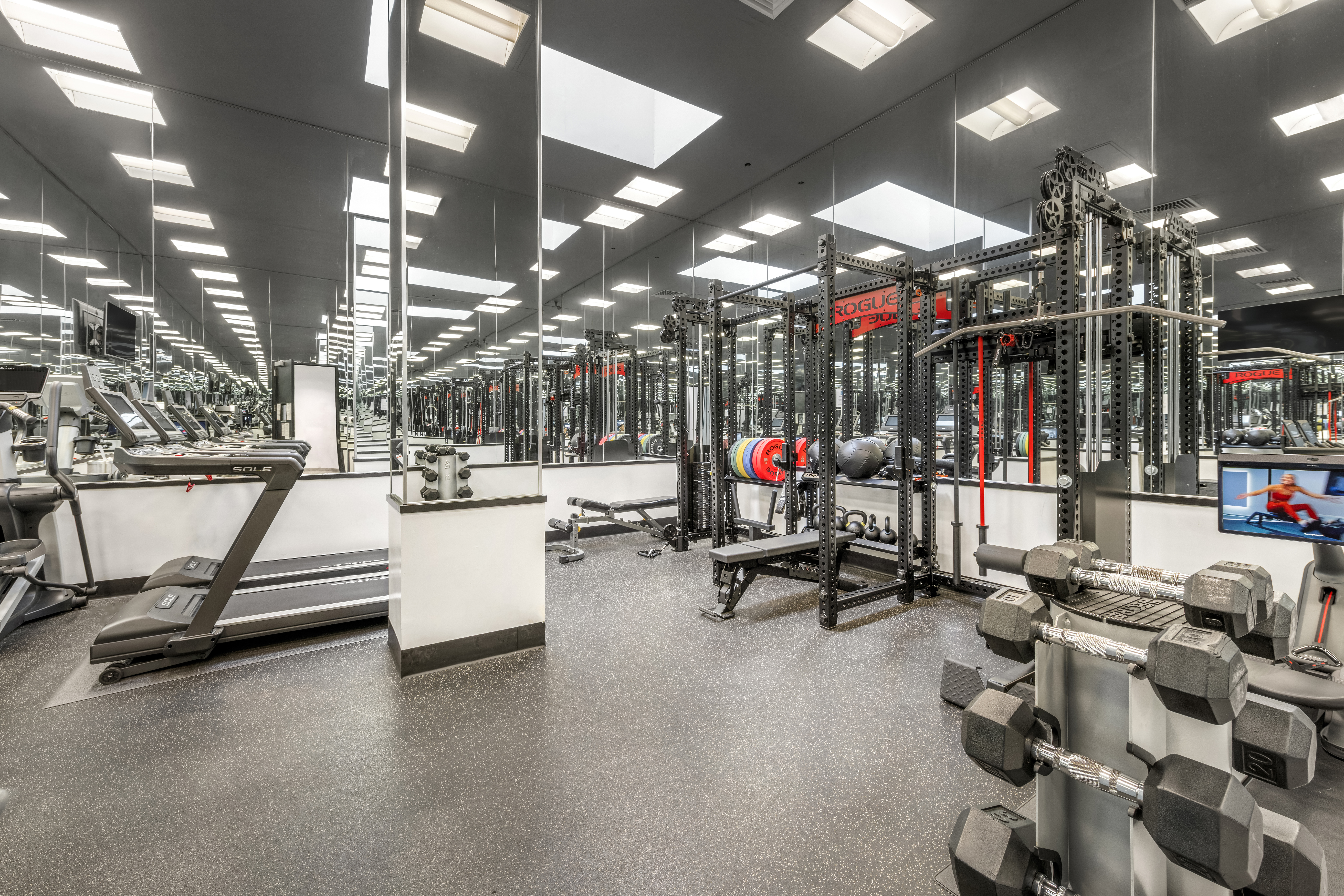 212 East 57th Street, Unit 3B Manhattan, NY 10022 - Photo 11 of 17 a view of a room with gym equipment