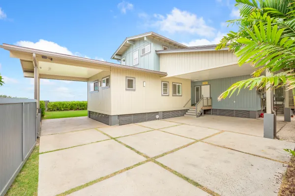 a view of a white house with a outdoor space