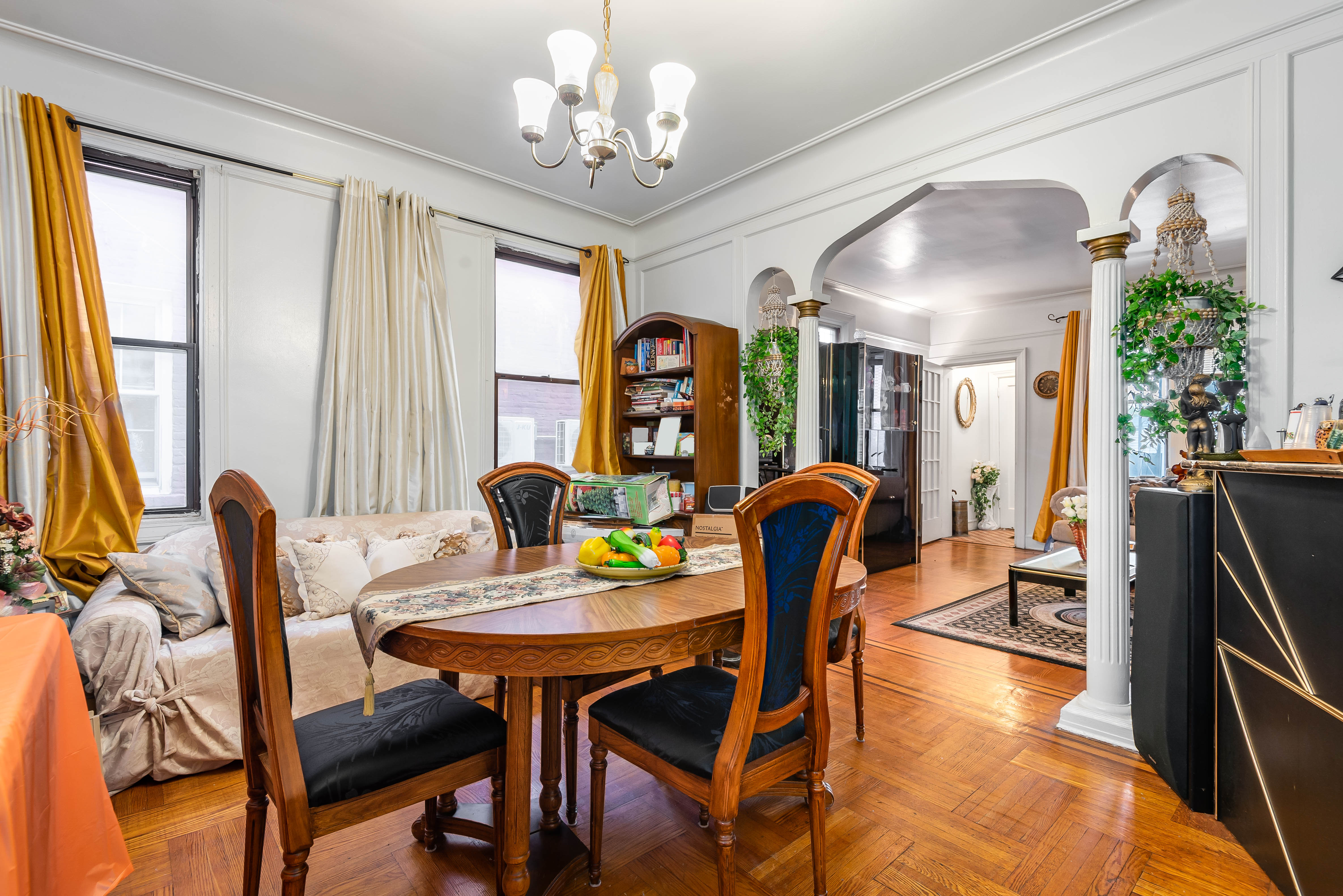 15 Lloyd Street Brooklyn, NY 11226 - Photo 3 of 18 a view of a dining room with furniture and a chandelier