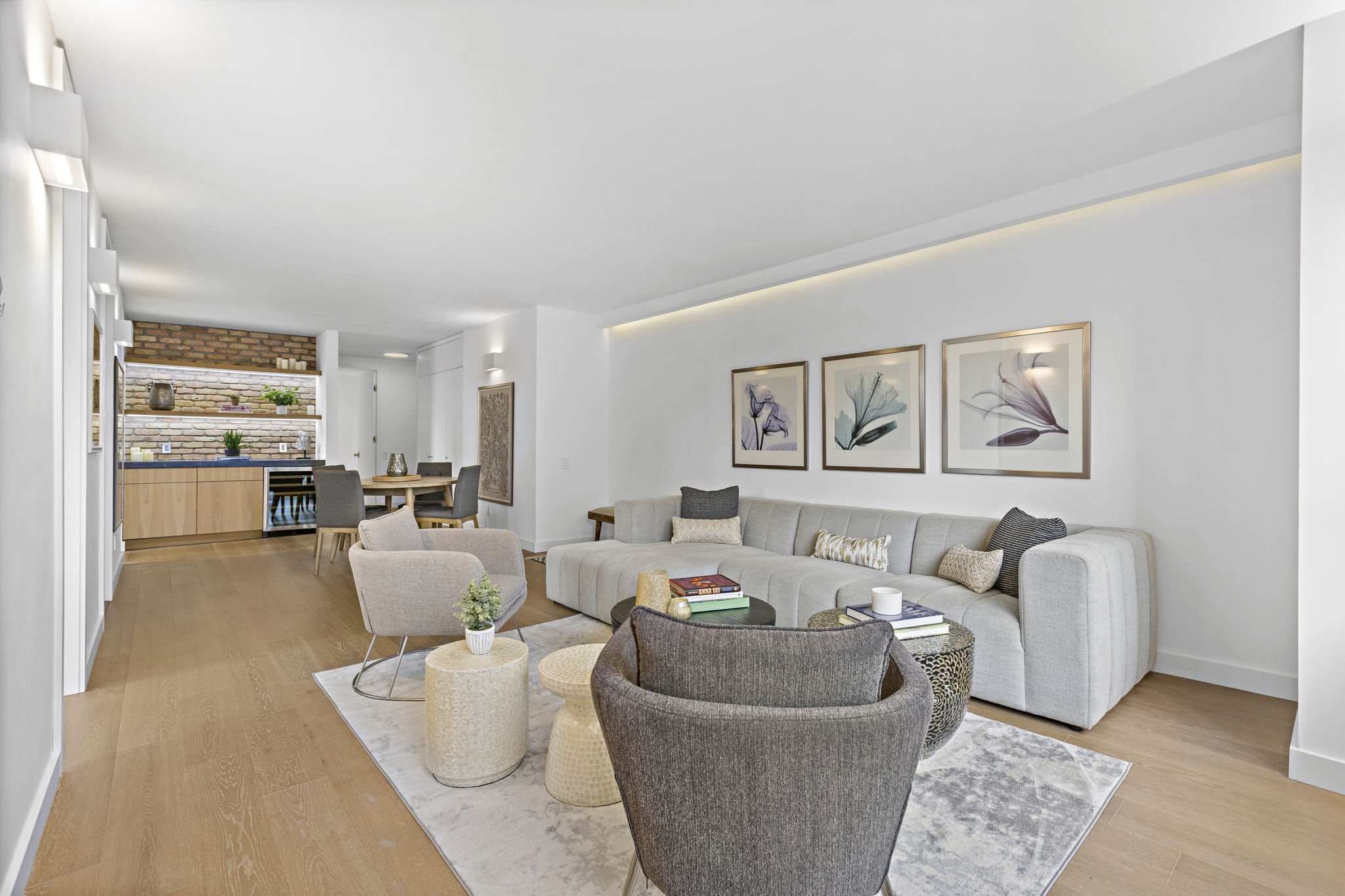 117 East 57th Street, Unit 21H Manhattan, NY 10022 - Photo 7 of 26 a living room with furniture and a large window