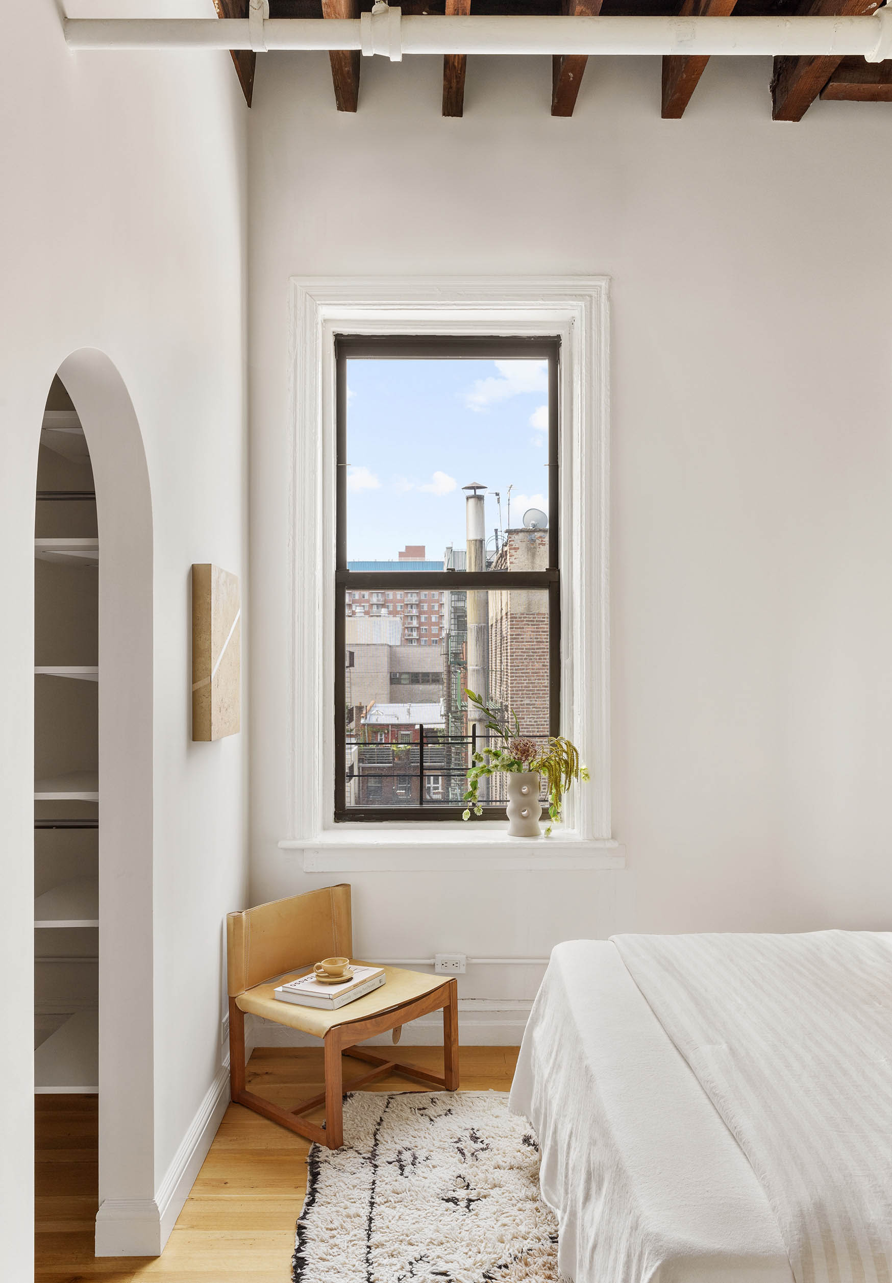 84 Forsyth Street, Unit 5R Manhattan, NY 10002 - Photo 9 of 14 a bedroom with a bed and a window