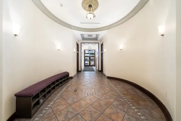 a view of a hallway with a chandelier