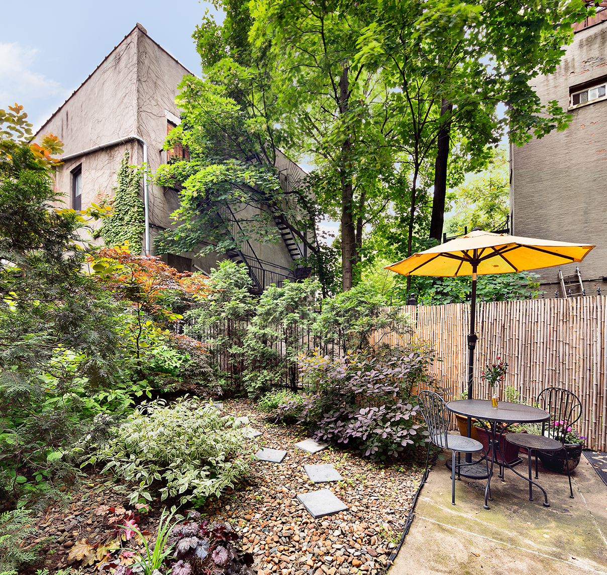 530 West 148th Street Manhattan, NY 10031 - Photo 2 of 14 a view of a chair and table in the backyard